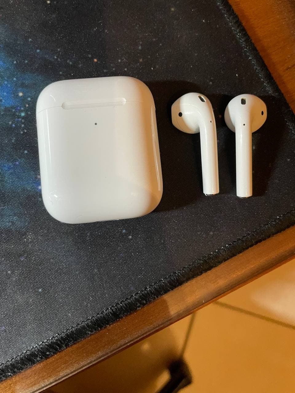 Apple AirPods auricolari wireless custodia ricarica Qi